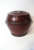 A Chinese red lacquer food container with metal handles and mounts, 23cm high,