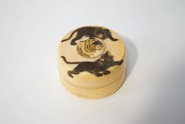 A late 19th/early 20th century Japanese ivory circular box and cover,