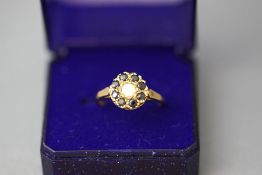 A 9 carat gold opal and sapphire cluster ring, finger size Q1/2, 2.