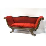 A Regency mahogany scroll frame chaise longue with gilt detail, on brass lion's paw feet,