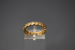 A 9 carat gold full hoop eternity ring, set with synthetics, 2.