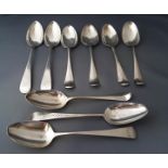 A pair of late George III silver table spoons; five bottom marked table spoons;