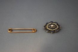 An Austro Hungarian sapphire and seed pearl brooch; and a gold pin, tagged '9ct', 3.