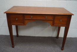 An Edwardian crossbanded mahogany desk with three drawers, on square tapering legs,