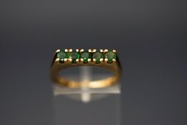 A 9 carat gold five stone emerald ring, finger size L, 2.