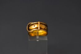 An 18 carat gold buckle ring, Chester 1881, 5.