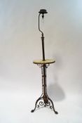 A Victorian brass lampstand with central onyx shelf,