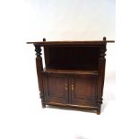 A late 19th century mahogany buffet with cupboard base, flanked by heavily carved columns,