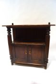 A late 19th century mahogany buffet with cupboard base, flanked by heavily carved columns,
