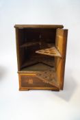 A parquetry table top cigar box, with each side opening to reveal triangular cigar holders ,