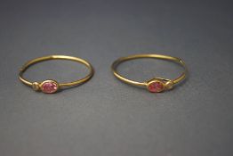 A pair of stone set hoop earrings, stamped '750,