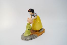A Royal Doulton Snow White figure, 'Dopey's First Kiss', limited edition 122/2000,