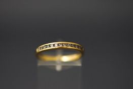 A thirteen stone diamond half hoop 18 carat gold ring,