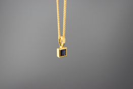 A 9 carat gold single stone sapphire pendant, on a 9 carat gold chain, 3.