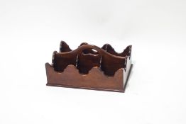 A mahogany six division decanter tray with shaped sides,