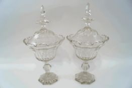 A pair of 19th century cut glass pedestal bowls and covers,