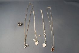 A small collection of silver and silver coloured jewellery