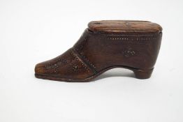 A late 18th Century treen snuff box in the form of a shoe with brass decoration,