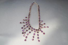 An amethyst cabochon bib necklace