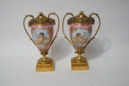 A pair of 19th century French porcelain cassolettes with gilt metal mounts,