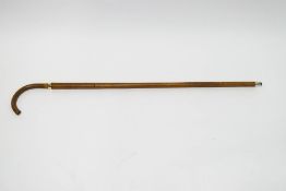 A French walking stick with narrow gold band engraved "En Sourier De Georges De Montgieriey" also