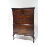 A George III style mahogany chest on chest, with an arrangement of short over four long drawers,