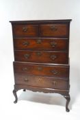A George III style mahogany chest on chest, with an arrangement of short over four long drawers,