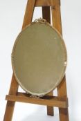 A 19th century oval wall mirror with gesso frame,