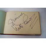 An Autograph book containing those of The Seekers, The Batchelors, Cliff Richard, and others,