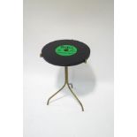 A mid 1960's occasional table, the top in the form of a Beatles record, Hard Days Night,