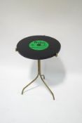 A mid 1960's occasional table, the top in the form of a Beatles record, Hard Days Night,