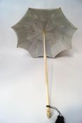 A 1920's Chinese ivory and black silk parasol,