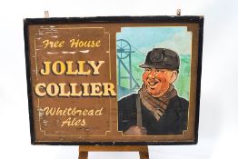 A large wooden pub sign for The Jolly Collier, Whitbread Ales,