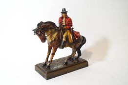 A spelter figure of a masked highwayman upon his horse,