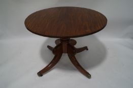 A 19th century mahogany table with outswept legs, 72cm high x 100cm diameter,