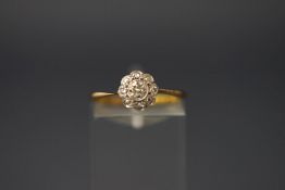 A five stone diamond flower head cluster ring, stamped '9ct', finger size N, 1.