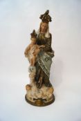 A Continental painted plaster figure of the Virgin Mary and the infant Jesus,