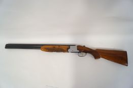 A Lorona 12 gauge, over and under shot gun, double trigger with single trigger option,