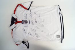 A signed England football shirt, including those of David Beckham, Gary Neville, Sol Campbell,