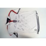 A signed England football shirt, including those of David Beckham, Gary Neville, Sol Campbell,