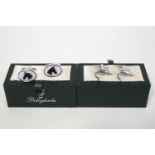 Two pairs of silver plated cufflinks, one with horse's heads,