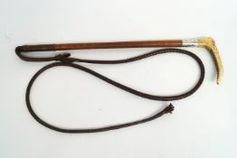 A Swaine Gentleman's silver mounted crop, the Antler handle with button and plaited leather shaft,
