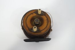 A Hardy's 31/2" walnut and brass 'Star back' reel with two ivorine handles,