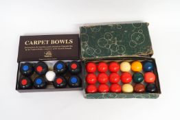 A Nauticalia carpet bowls set and a box of small size snooker balls