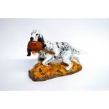 A Royal Doulton figure of an English Setter with a pheasant,