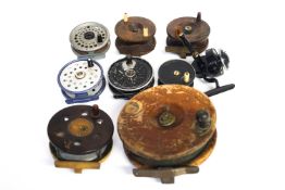 A collection of fishing reels,