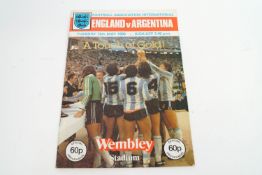 An England v Argentina programme, signed by Maradona Sansom,