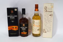 A bottle of Arran single malt whisky and a bottle of Highland Park 12 year whisky