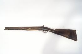 A Paget type percussion shotgun and flask