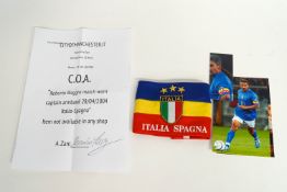 A Captain Roberto Baggio armband with certificate and photograph,